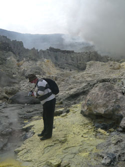 Sergey I. Leontiev, Dean of Mining-and-Geological Department, in quest for geological samples in the vent of Idzhin volcano (Java-island, Indonesia)